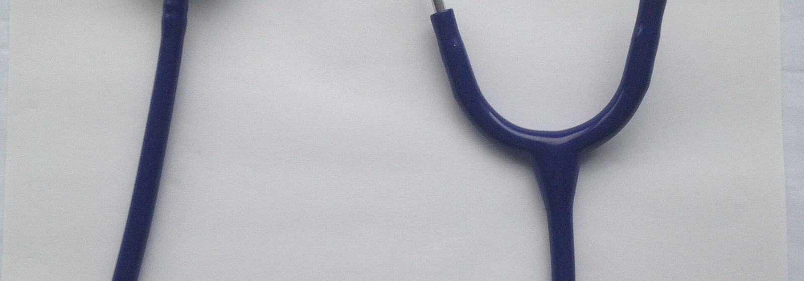 Stethoscope on paperwork used for insurance billing